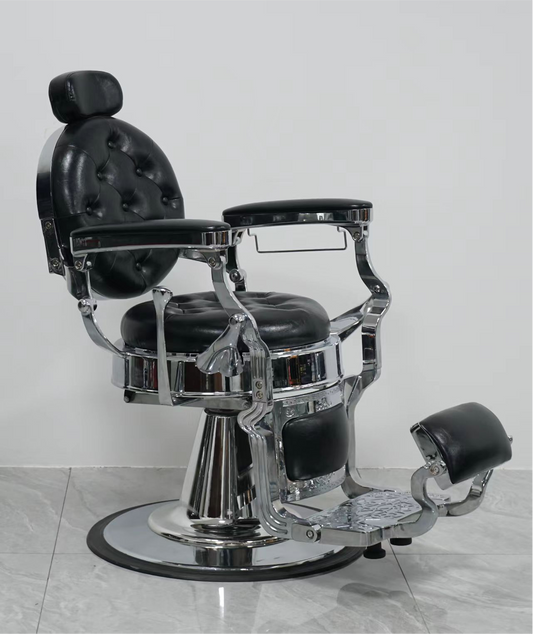 Elegant black barber chair with chrome accents