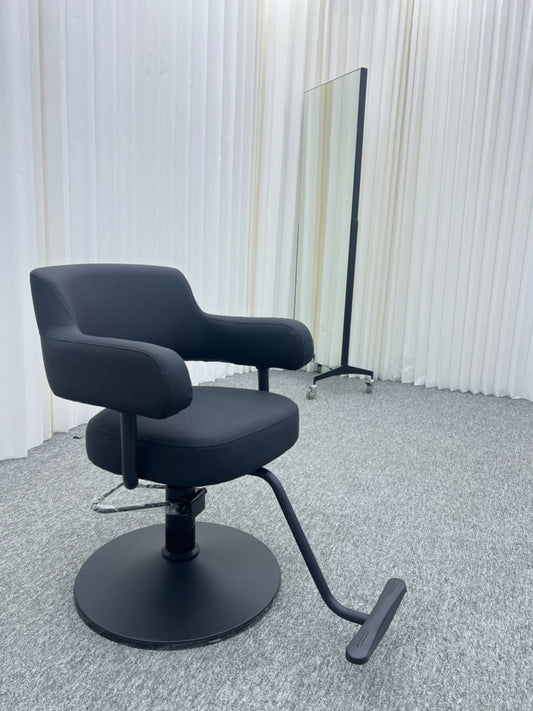 Modern black hairdressing chair with ergonomic design