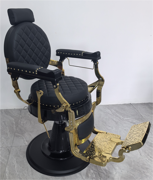 Luxurious barber chair in black with gold-plated frame