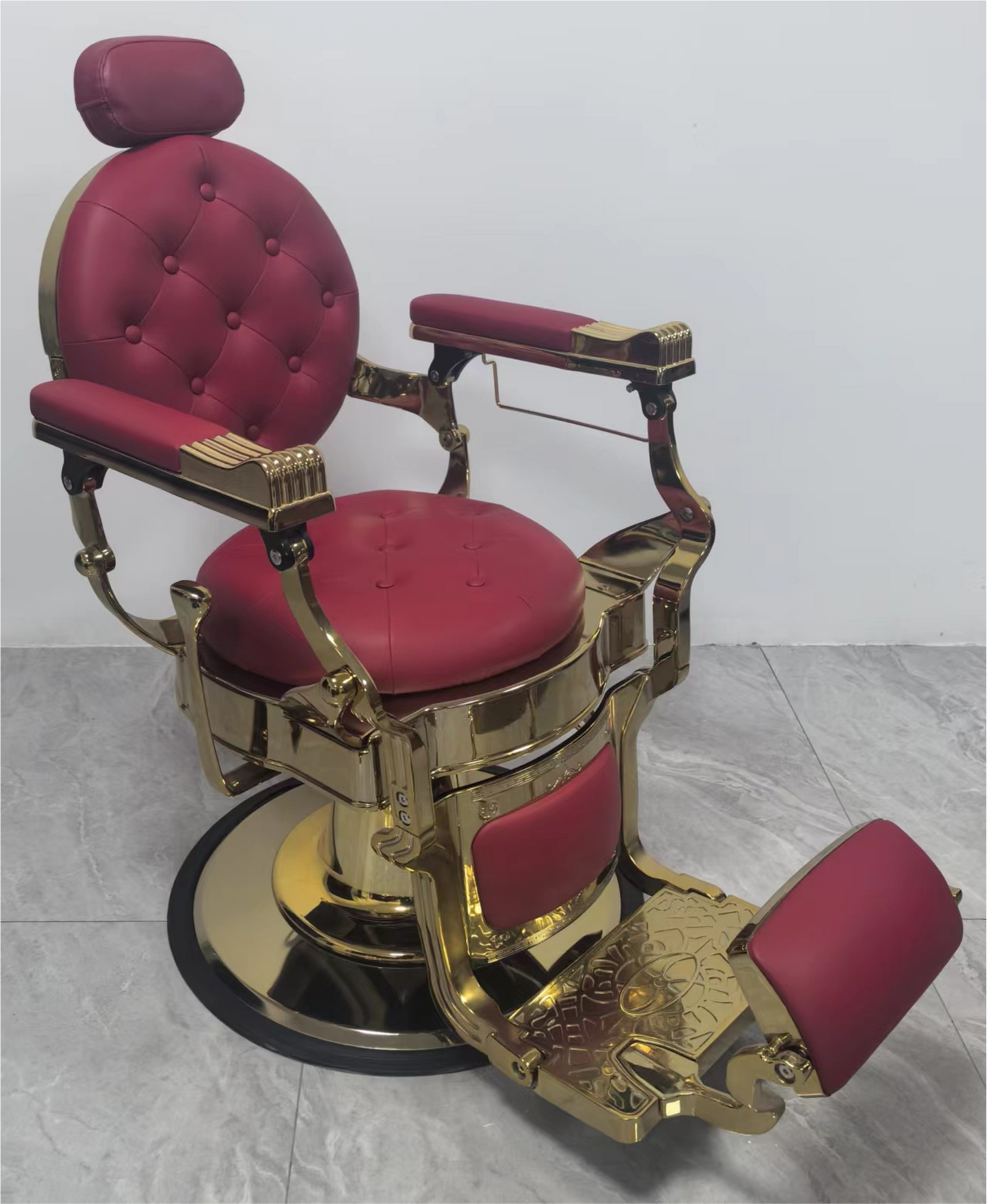 Luxurious barber chair in red with gold accents