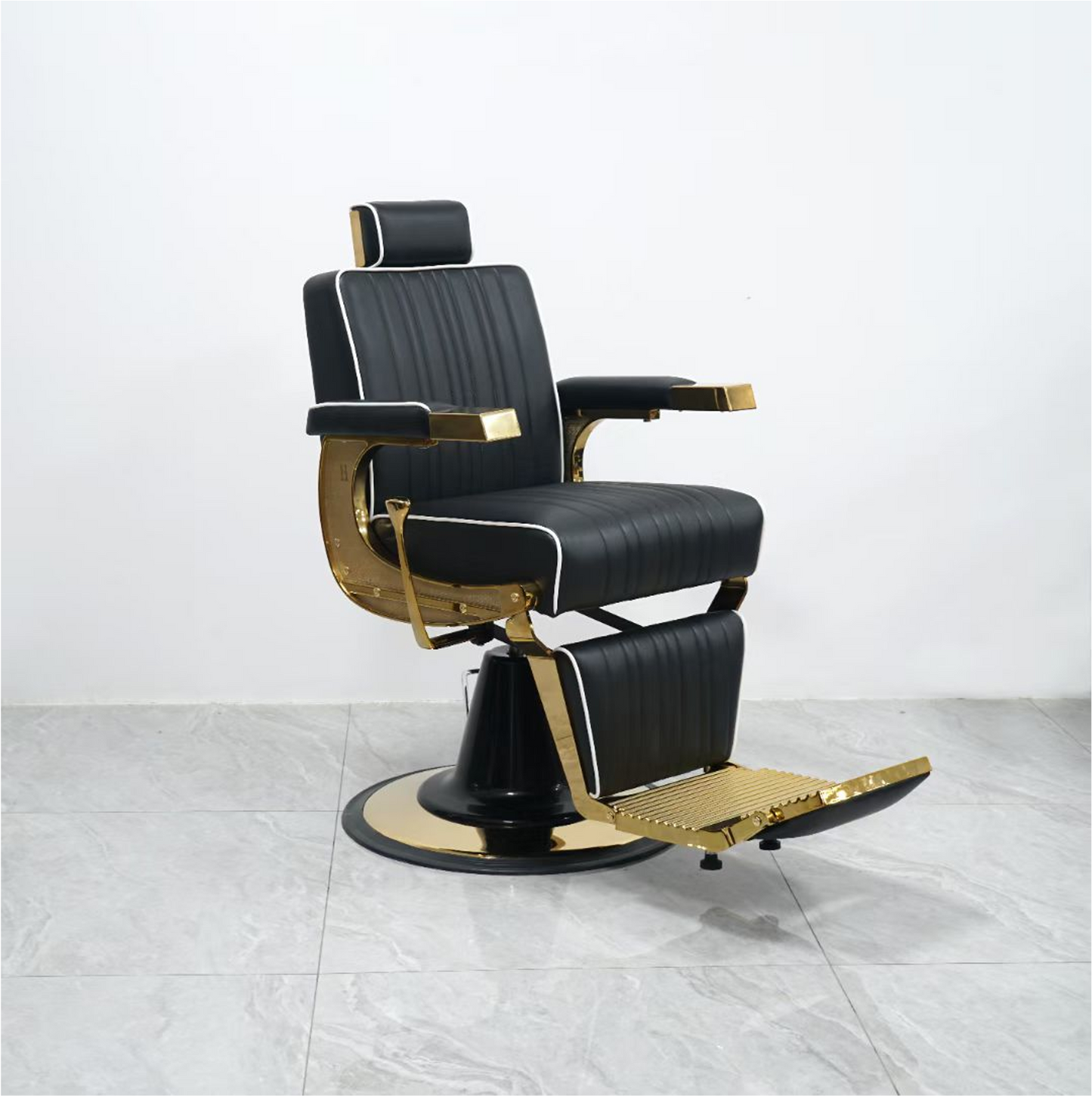 Luxurious barber chair in black with gold accents